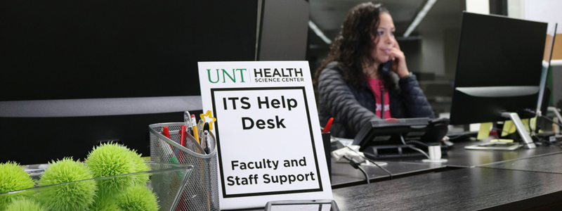 an IT helpdesk staff member at the welcome desk
