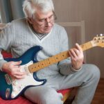 Older Man Playing Electric Guitarsm