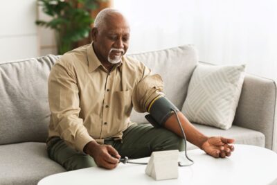 Older Black Man Taking Blood Pressure Sm