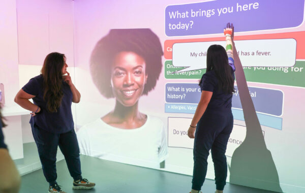 PA students interacting with projections in the simulation center