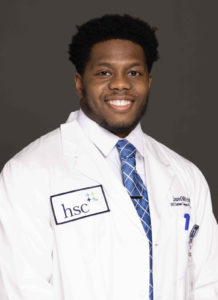 Image of Jared Mitchell wearing a white coat