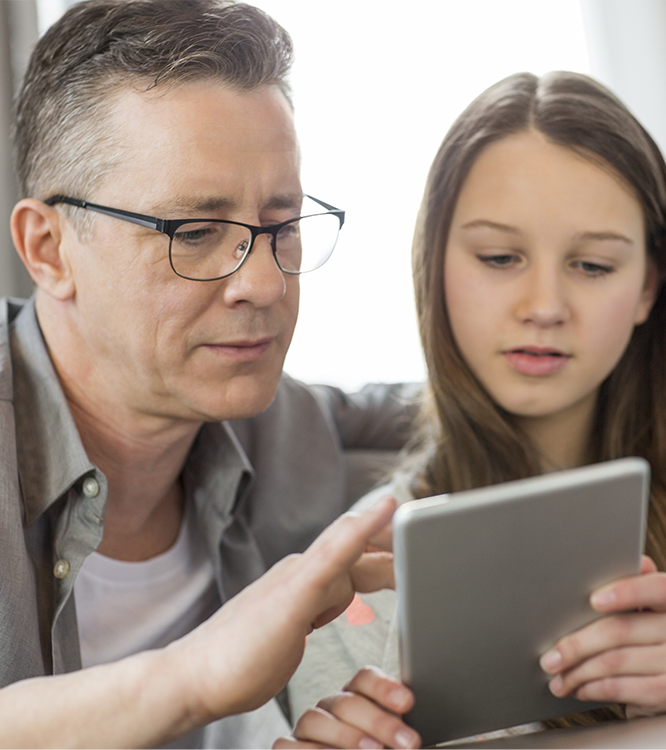 Father And Daughter On Tablet