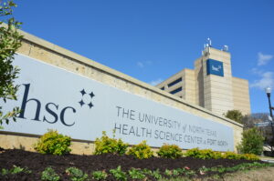 a monument sign in front of the HSC campus