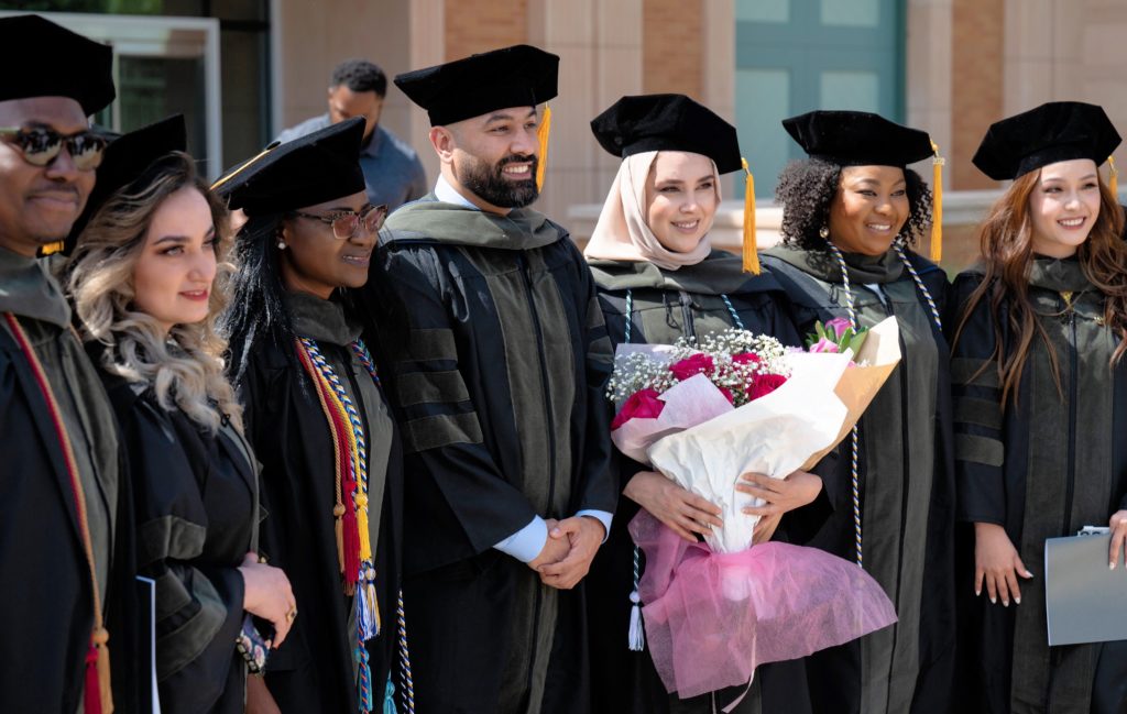 graduate students in cap and gowns